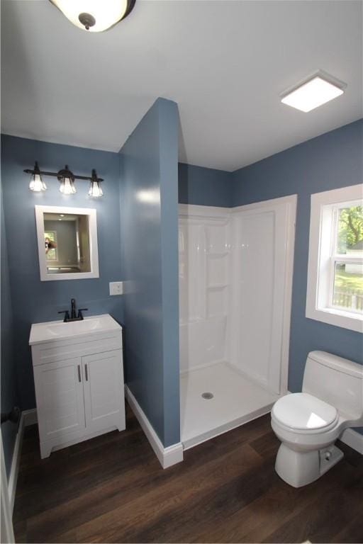 38 Spring St, Sweden, NY 14420 - bathroom featuring wood finished floors, walk in shower, and vanity