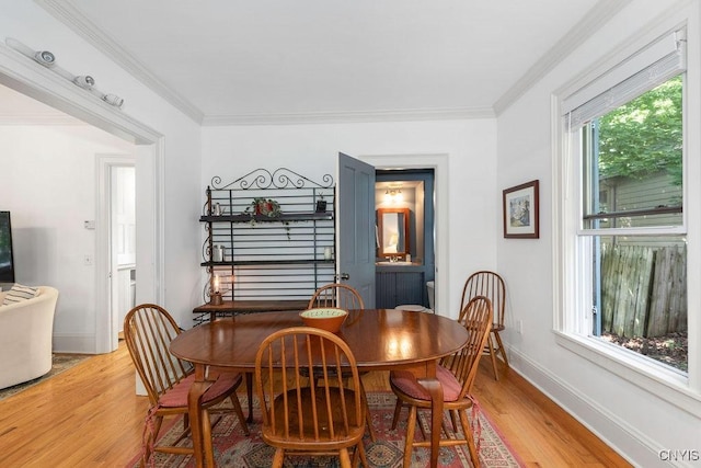 6 Union St, Cazenovia, NY 13035 - dining area with light wood-style flooring and crown molding