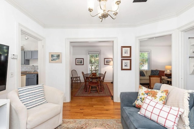 6 Union St, Cazenovia, NY 13035 - living area featuring a chandelier, light wood-style flooring, and ornamental molding