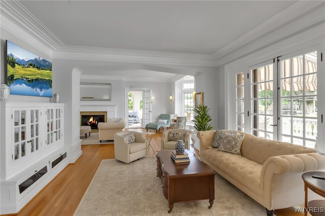 6862 Lake Shore Rd, Evans, NY 14047 - living area with wood finished floors, crown molding, and a glass covered fireplace