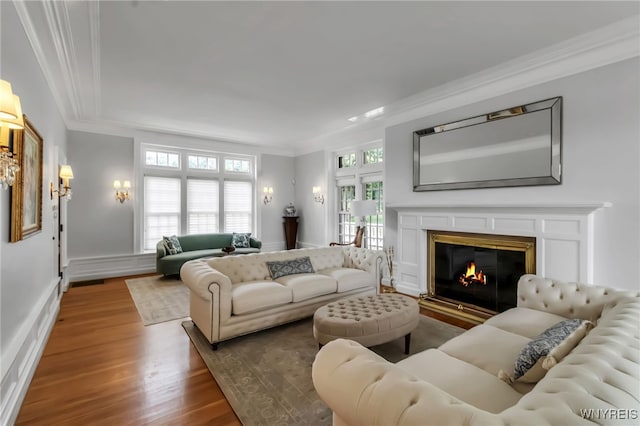 6862 Lake Shore Rd, Evans, NY 14047 - living area with ornamental molding, wood finished floors, and a glass covered fireplace
