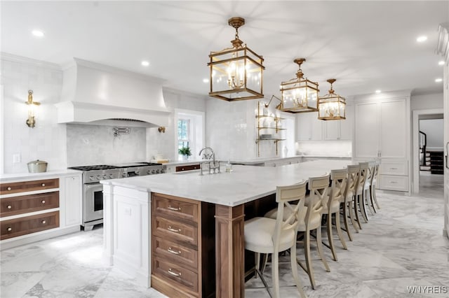6862 Lake Shore Rd, Evans, NY 14047 - kitchen featuring stainless steel stove, light marble finish floors, decorative backsplash, recessed lighting, and a chandelier
