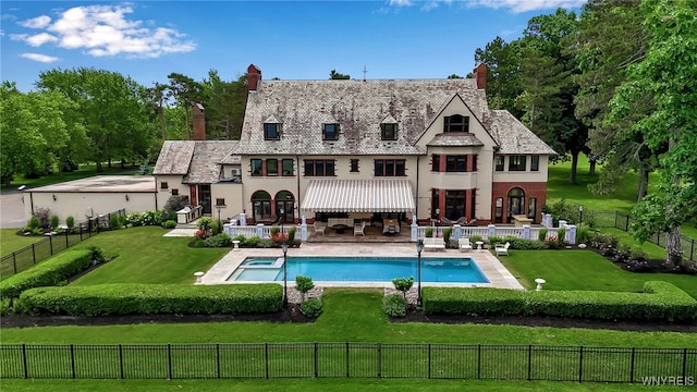 6862 Lake Shore Rd, Evans, NY 14047 - rear view of house featuring stucco siding, a chimney, a patio, and a fenced backyard