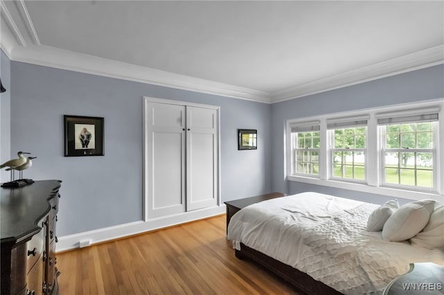 6862 Lake Shore Rd, Evans, NY 14047 - bedroom with light wood-style floors and crown molding