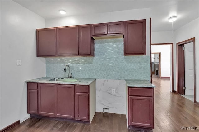 20 Rejtan St, Buffalo, NY 14206 - kitchen with dark wood-style flooring, tasteful backsplash, and light stone counters