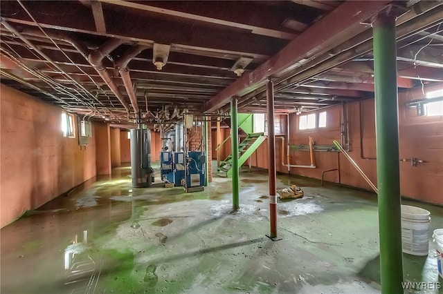 20 Rejtan St, Buffalo, NY 14206 - below grade area featuring water heater, stairway, and a heating unit