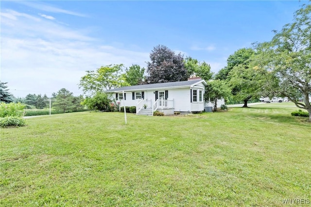 9015 Donahue Rd, Batavia, NY 14020 - back of property with a yard and a chimney