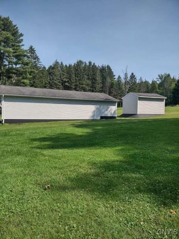 7408 Rome Oriskany Rd, Rome, NY 13440 - view of green lawn with an outdoor structure