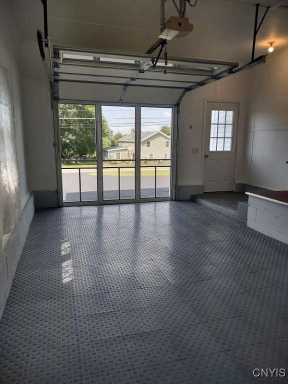7408 Rome Oriskany Rd, Rome, NY 13440 - garage featuring a garage door opener