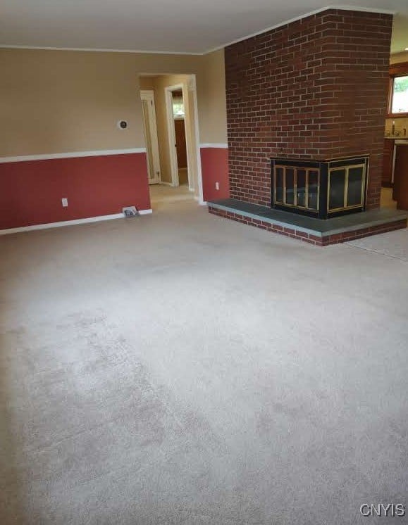 7408 Rome Oriskany Rd, Rome, NY 13440 - unfurnished living room with carpet floors and a fireplace