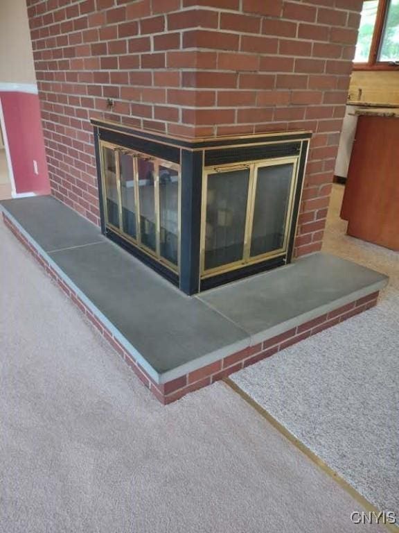 7408 Rome Oriskany Rd, Rome, NY 13440 - detailed view of a fireplace and carpet flooring