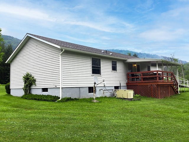 8198 Rte 46, Keating Town, PA 16749 - back of house with a lawn and a deck with mountain view