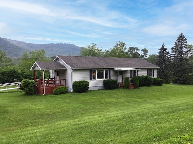8198 Rte 46, Keating Town, PA 16749 - ranch-style house with a front yard, roof with shingles, and a deck with mountain view