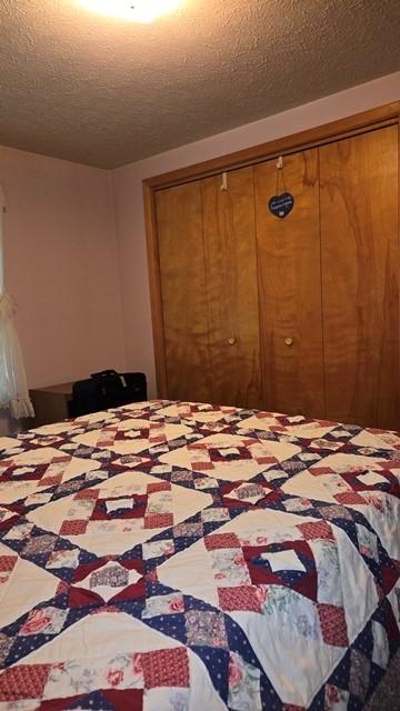 8198 Rte 46, Keating Town, PA 16749 - bedroom with a textured ceiling