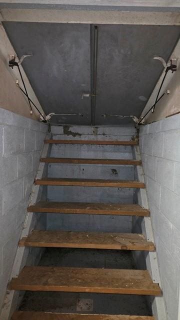 8198 Rte 46, Keating Town, PA 16749 - staircase featuring concrete block wall