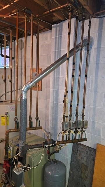 8198 Rte 46, Keating Town, PA 16749 - utility room featuring gas water heater and a heating unit
