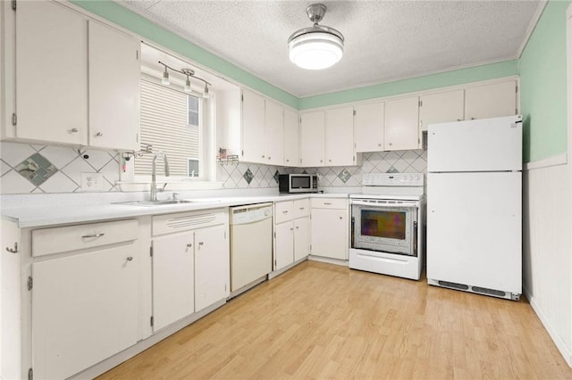 113 Myrtle St, Leroy, NY 14482 - kitchen featuring white appliances, tasteful backsplash, light wood finished floors, and a textured ceiling