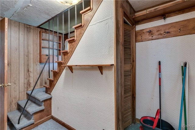 7259 Number Four Rd, Watson, NY 13367 - basement featuring stairway, wooden walls, and carpet