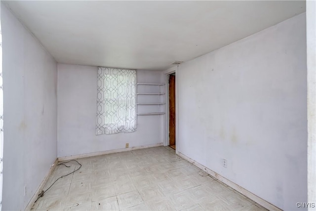 7259 Number Four Rd, Watson, NY 13367 - empty room with tile patterned floors and baseboards