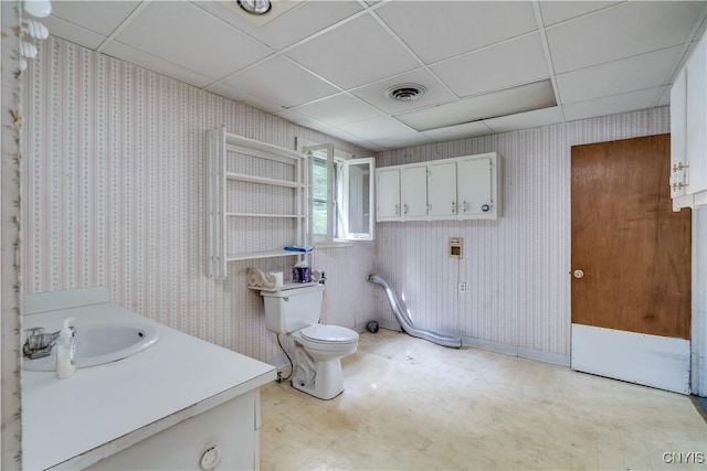 7259 Number Four Rd, Watson, NY 13367 - bathroom with a paneled ceiling, wallpapered walls, and vanity
