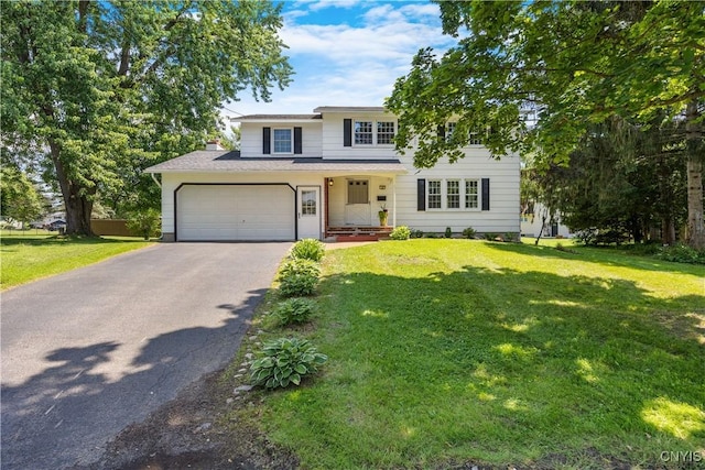14 Ibis, Clay, NY 13090 - traditional-style house featuring asphalt driveway, a front yard, a chimney, and a garage