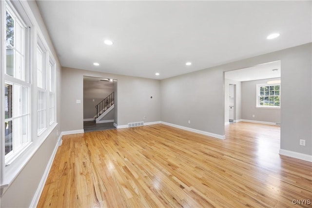 14 Ibis, Clay, NY 13090 - spare room with stairway, light wood-style floors, and recessed lighting