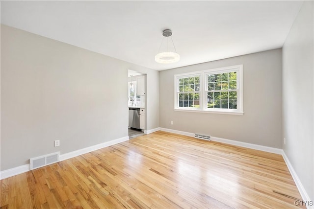 14 Ibis, Clay, NY 13090 - empty room featuring light wood-type flooring