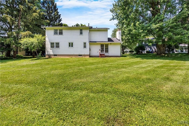 14 Ibis, Clay, NY 13090 - back of property featuring crawl space, a yard, a chimney, and entry steps