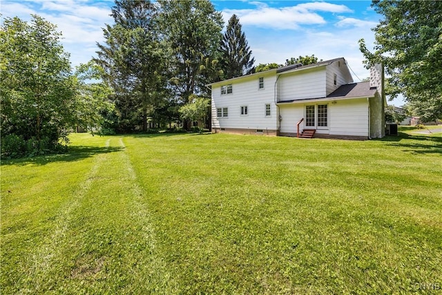 14 Ibis, Clay, NY 13090 - back of house featuring entry steps and a lawn