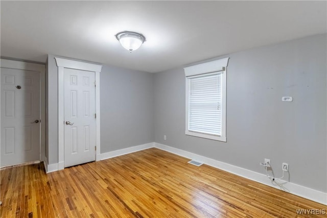 52 Harbor St, Wilson, NY 14172 - unfurnished bedroom with light wood-style flooring and baseboards