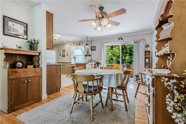16 Vine Cir, Whitestown, NY 13492 - dining area featuring light wood-style flooring, a ceiling fan, and crown molding