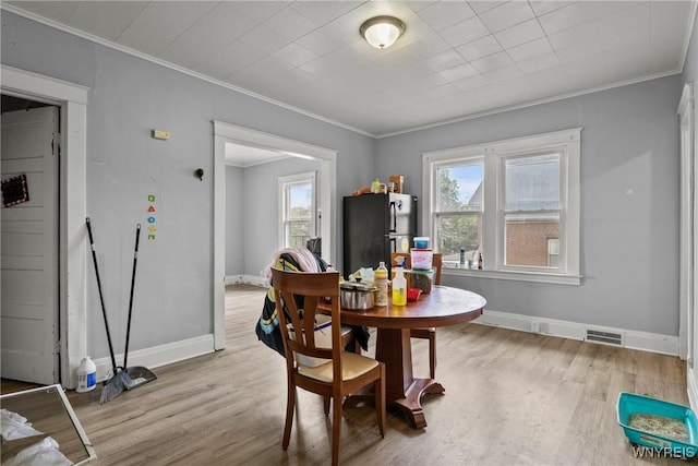 1810 Niagara St, Niagara Falls, NY 14303 - dining space with crown molding and light wood-type flooring