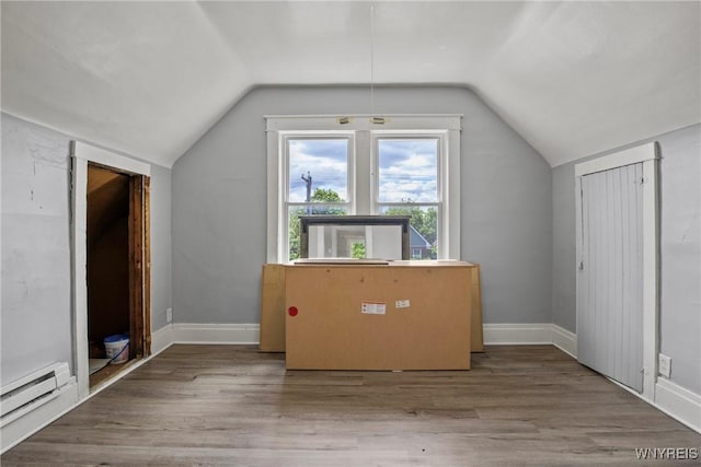 1810 Niagara St, Niagara Falls, NY 14303 - additional living space with lofted ceiling, a baseboard radiator, and wood finished floors