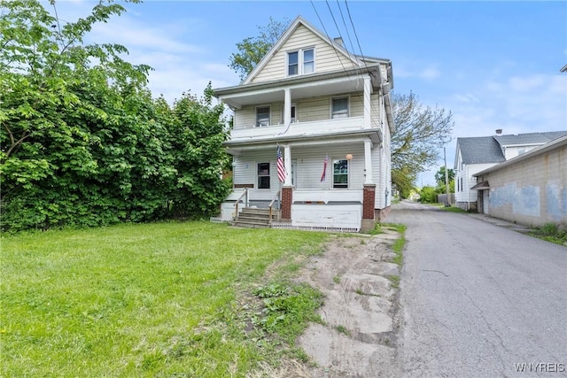 1810 Niagara St, Niagara Falls, NY 14303 - traditional style home with covered porch, asphalt driveway, and a front yard