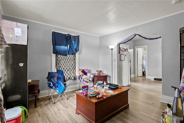1810 Niagara St, Niagara Falls, NY 14303 - living room with wood finished floors, crown molding, and a textured ceiling