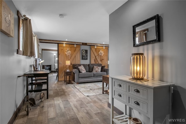 2244 Lockport Olcott Rd, Newfane, NY 14108 - living room featuring wood finished floors, recessed lighting, and a barn door