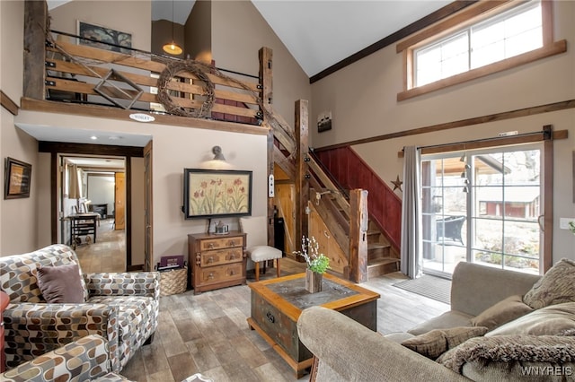 2244 Lockport Olcott Rd, Newfane, NY 14108 - living room with high vaulted ceiling, stairway, and wood finished floors