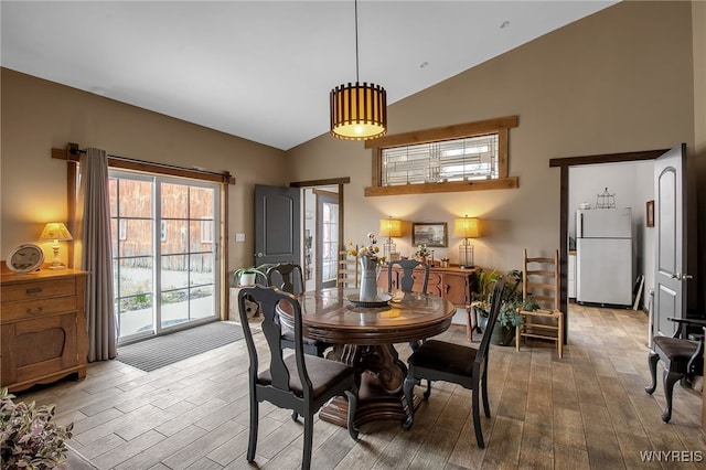 2244 Lockport Olcott Rd, Newfane, NY 14108 - dining area with wood finished floors and high vaulted ceiling