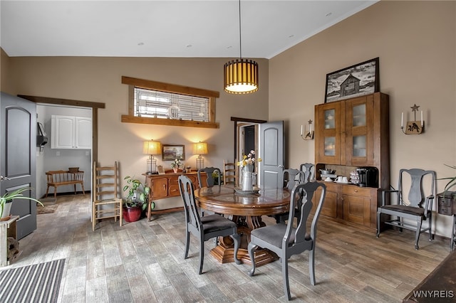 2244 Lockport Olcott Rd, Newfane, NY 14108 - dining area featuring high vaulted ceiling and wood finished floors