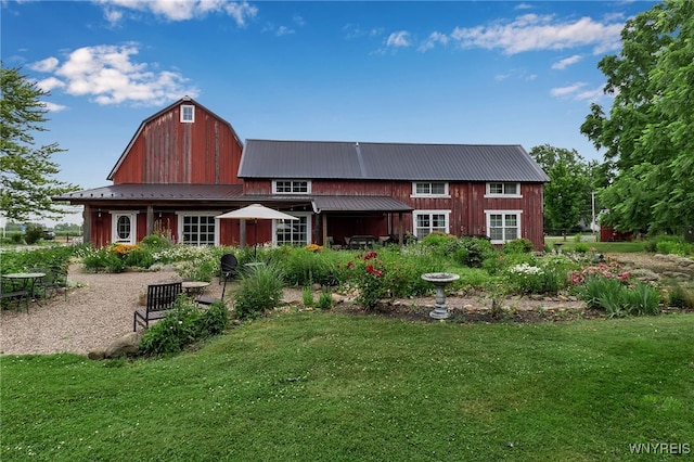 2244 Lockport Olcott Rd, Newfane, NY 14108 - back of property with a lawn, a barn, a metal roof, and a gambrel roof