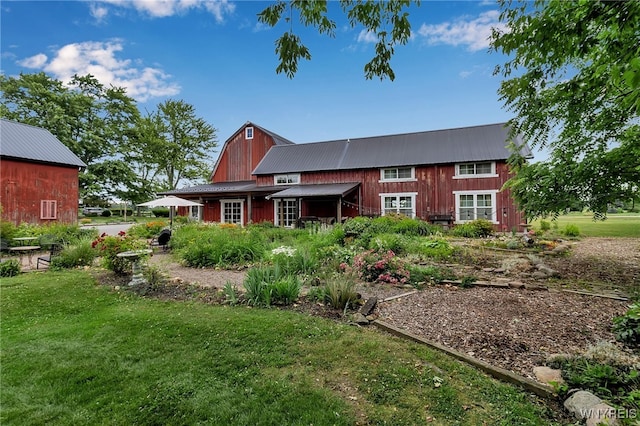 2244 Lockport Olcott Rd, Newfane, NY 14108 - back of house featuring a yard, a metal roof, and a barn
