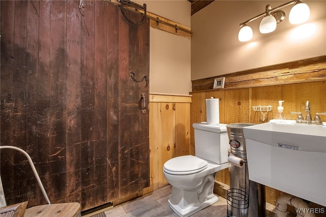 2244 Lockport Olcott Rd, Newfane, NY 14108 - bathroom with toilet and wood walls