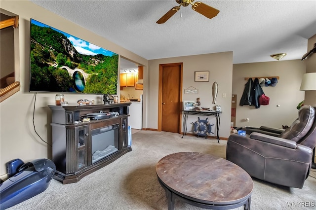 6192 Thornwood Dr, Boston, NY 14075 - living area with light carpet, a textured ceiling, and ceiling fan