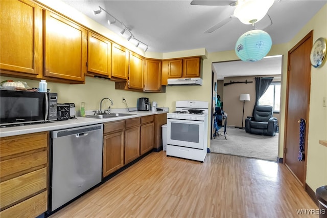 6192 Thornwood Dr, Boston, NY 14075 - kitchen featuring dishwasher, white gas range, black microwave, under cabinet range hood, and light countertops