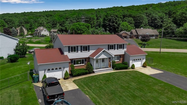 6192 Thornwood Dr, Boston, NY 14075 - view of front of property with a view of trees, asphalt driveway, and brick siding