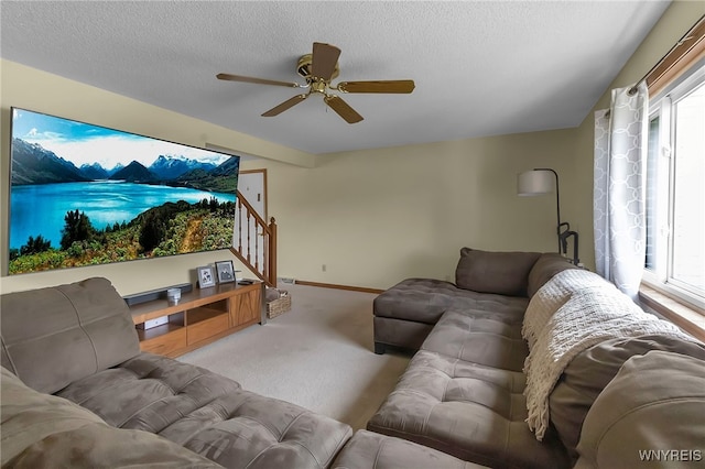 6192 Thornwood Dr, Boston, NY 14075 - carpeted living area with a ceiling fan, stairs, and a textured ceiling