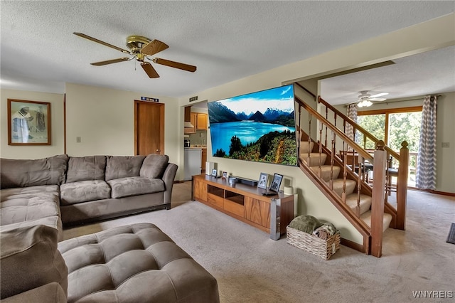 6192 Thornwood Dr, Boston, NY 14075 - living area with a ceiling fan, light colored carpet, stairway, and a textured ceiling