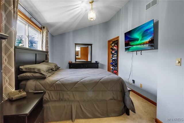 6192 Thornwood Dr, Boston, NY 14075 - carpeted bedroom featuring lofted ceiling and baseboards