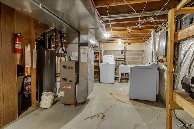 6192 Thornwood Dr, Boston, NY 14075 - unfinished below grade area with washer and clothes dryer, heating unit, gas water heater, and electric panel