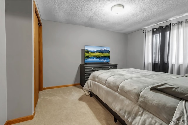 6192 Thornwood Dr, Boston, NY 14075 - bedroom featuring a textured ceiling and light colored carpet